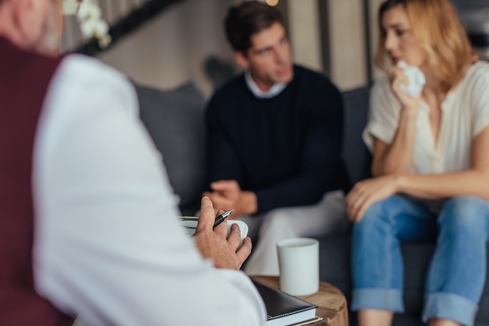 psychotherapist counseling young couple