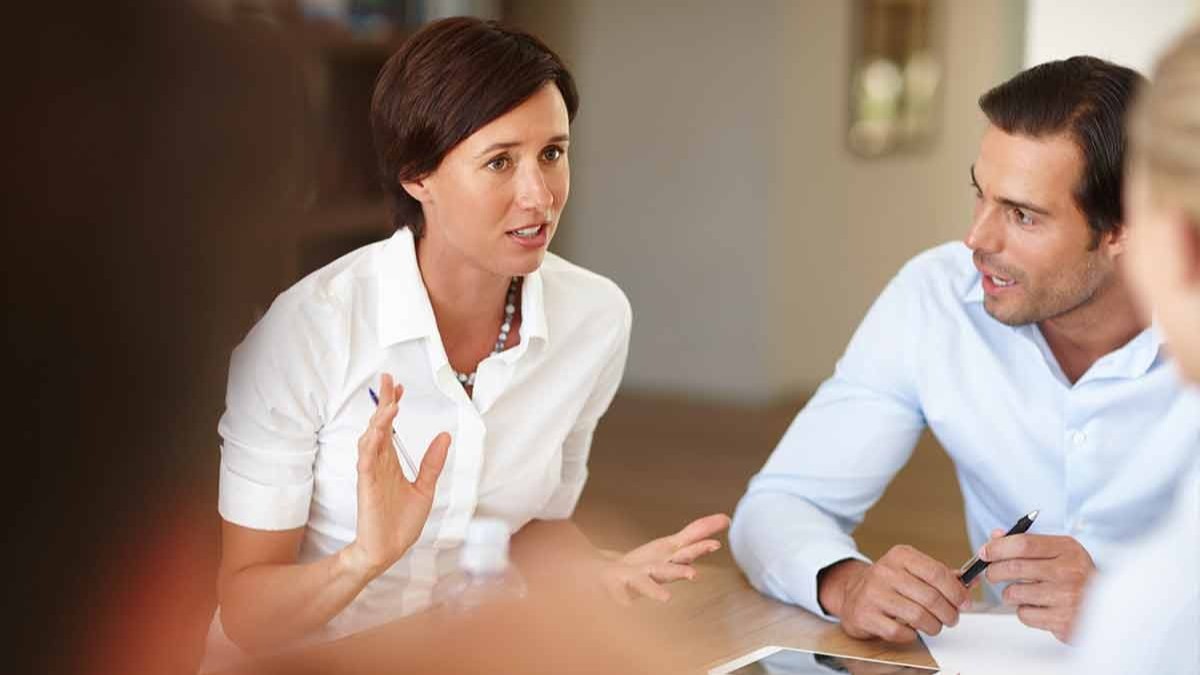 a california couple using laptops for an online mediation session