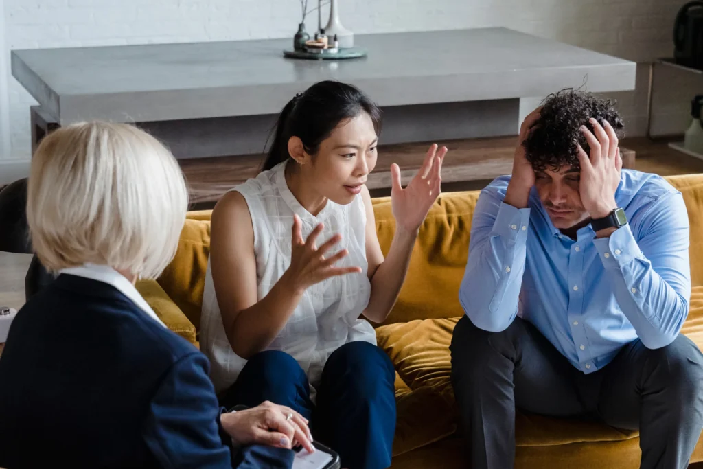 a mediator guiding a michigan city couple through divorce discussions in 2025, focusing on cooperation and peaceful solutions.