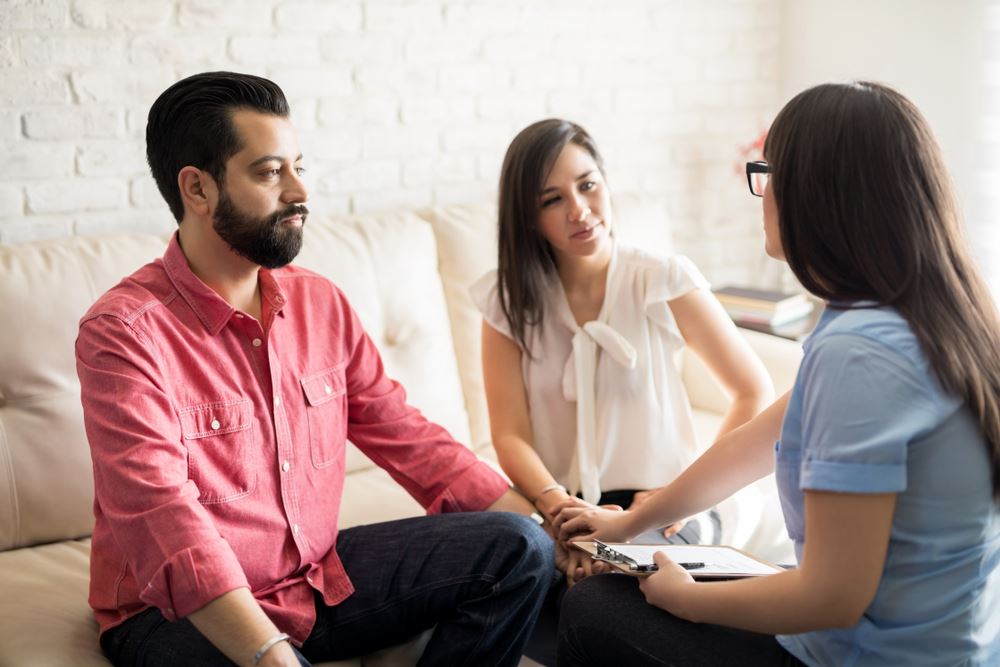 a michigan city family working with a mediator in a calm setting, highlighting cooperation over court conflict.