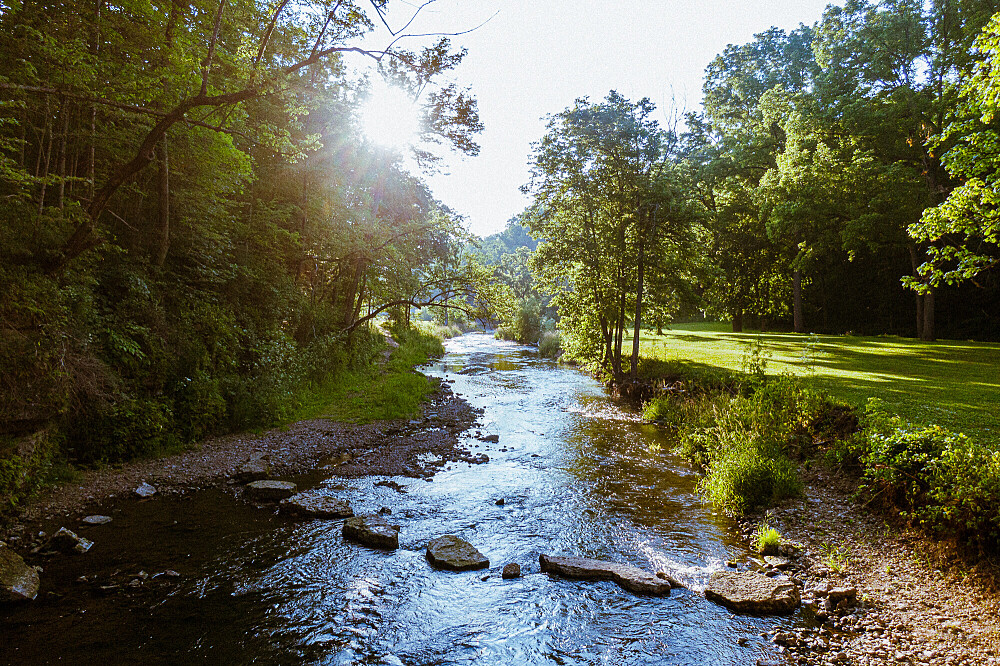 person walking peacefully along michigan city beach after divorce mediation.