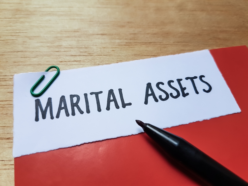 marital,assets,writting,on,table,background.