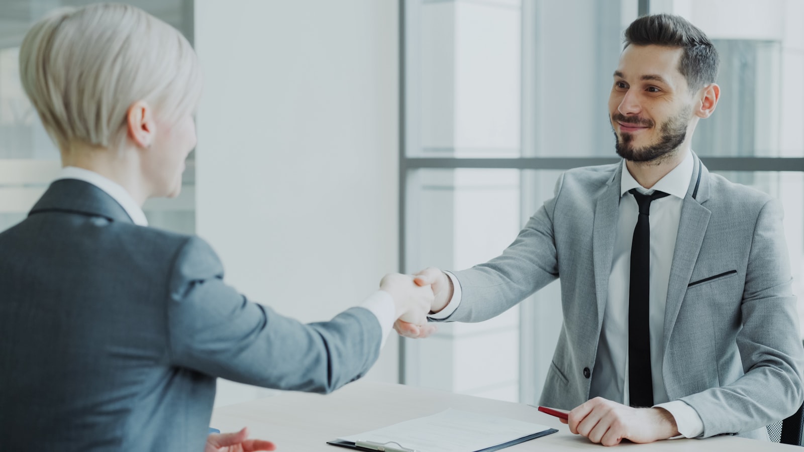 Two people reaching agreement through mediation instead of litigation