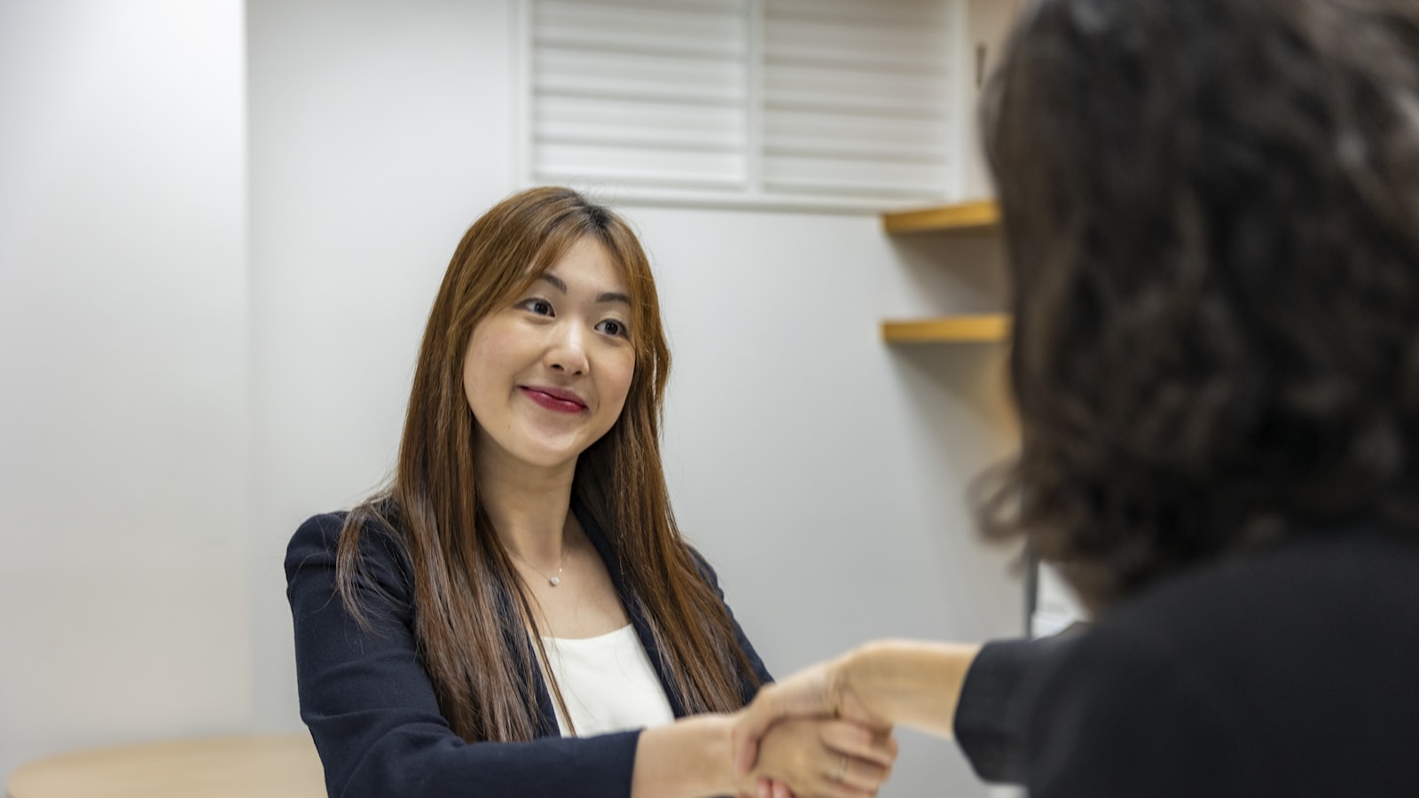 Mediator welcoming a client to a first divorce mediation session