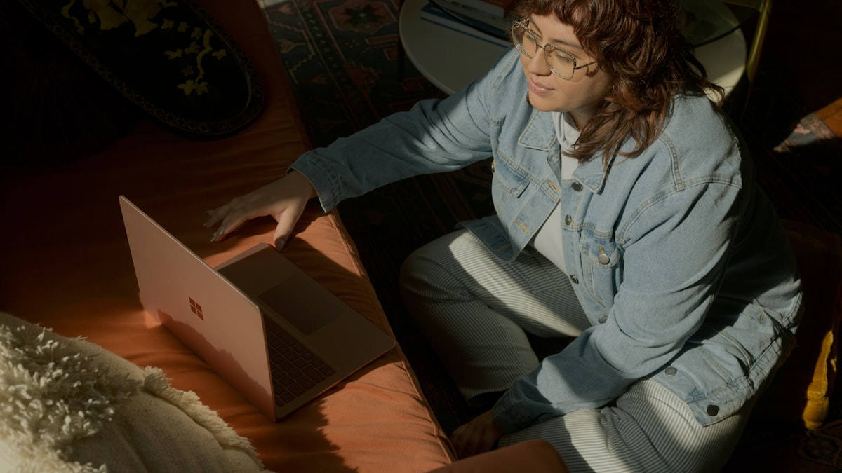 Woman attending virtual divorce mediation on a laptop
