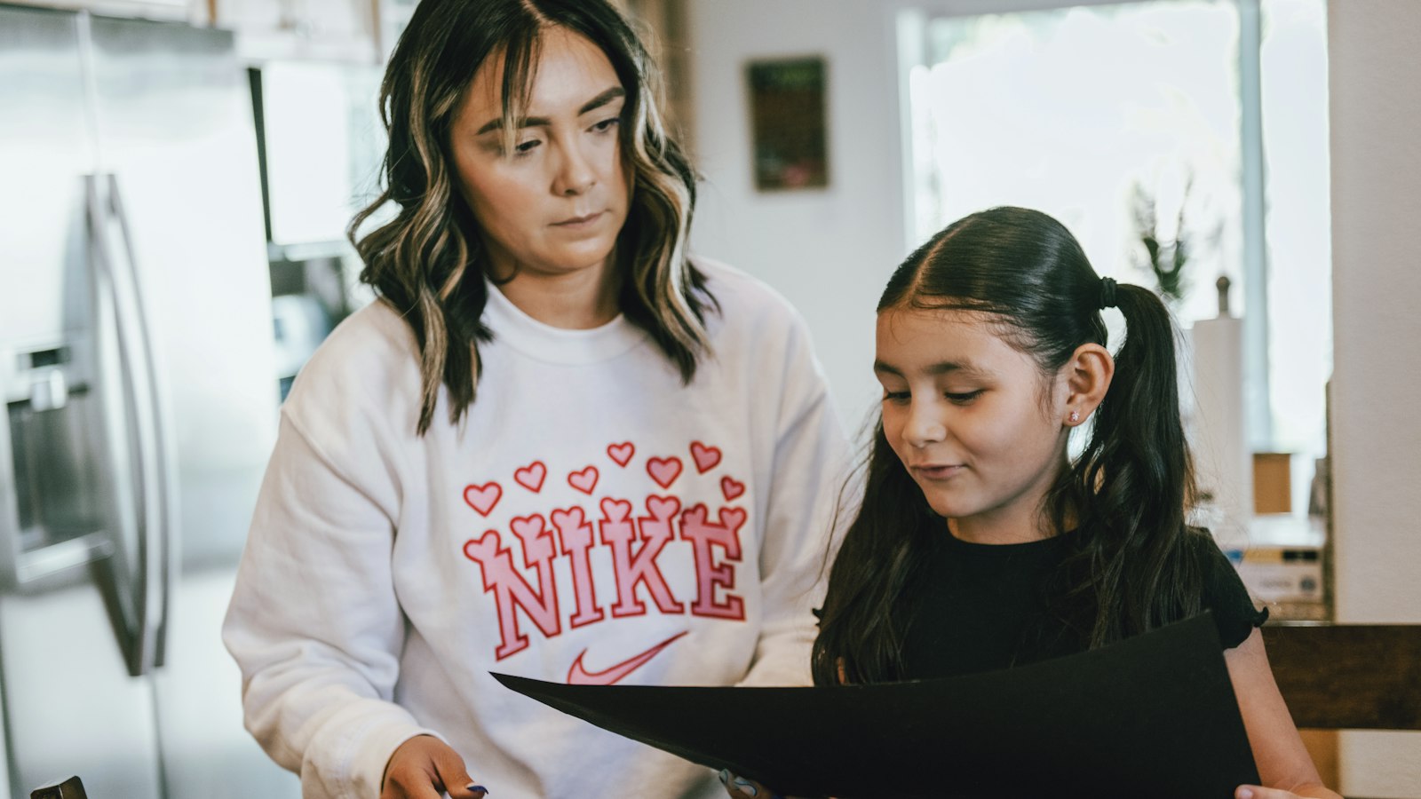 Parent and child in the kitchen, sharing costs in a child support agreement